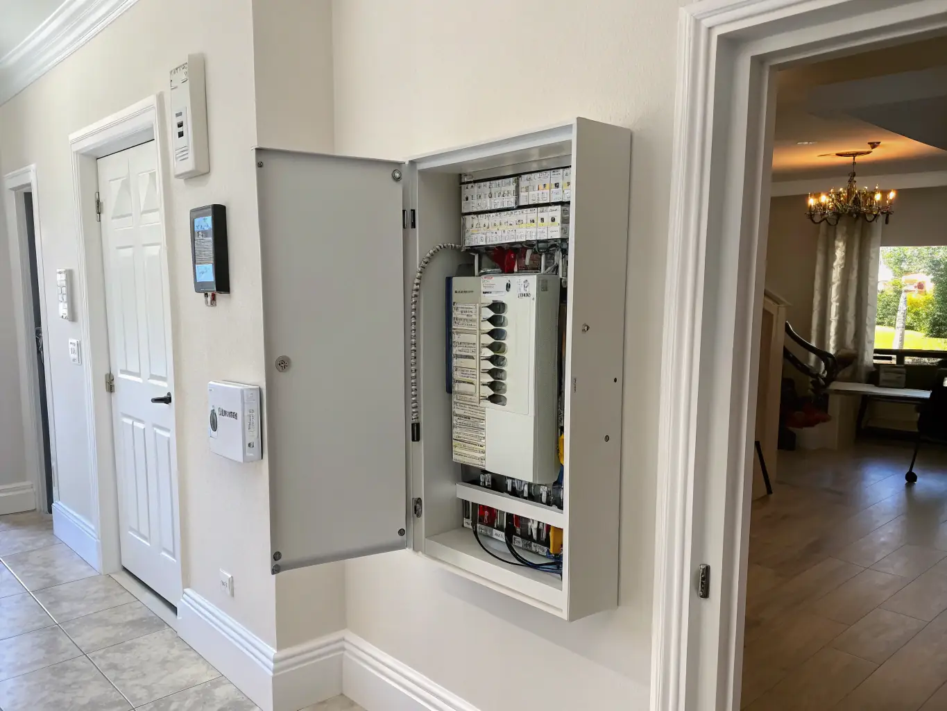 A high-quality, professional photograph showcasing a newly installed, modern electrical panel in a home setting. The panel should be clean, well-organized, and properly labeled, emphasizing safety and efficiency.